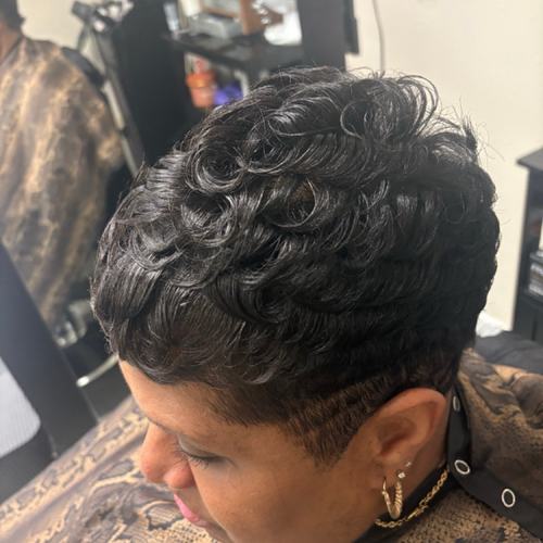 Curly black pixie with tapered nape